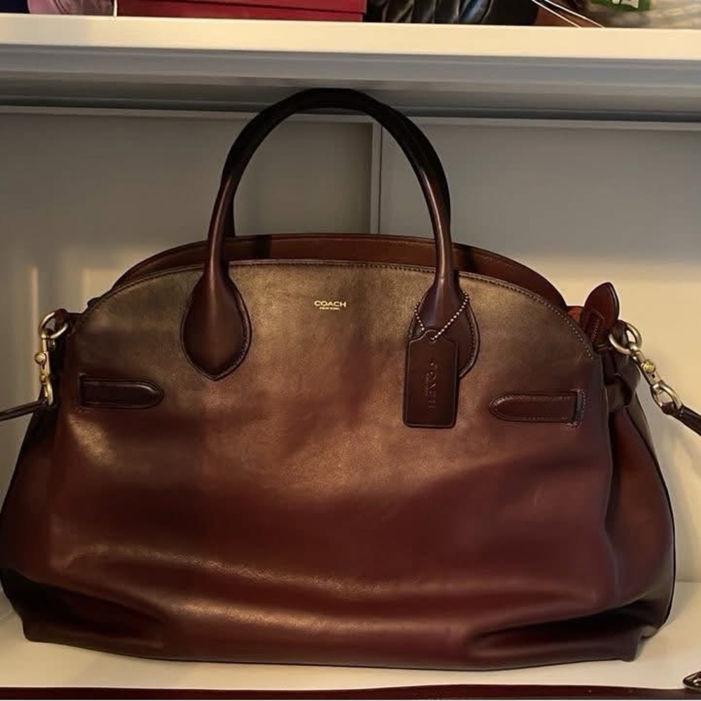 Coach 48 Merlot Empire has seen some world! Too big of a bag for me!